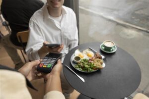 person-paying-using-nfc-technology