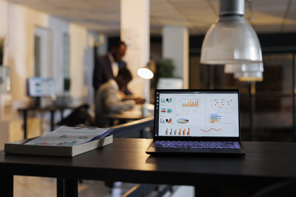 Laptop computer showing marketing statistics on screen